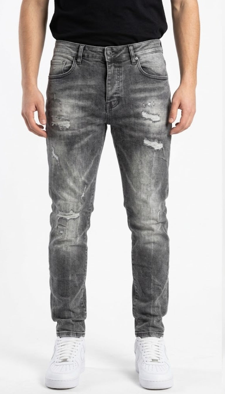Jeans Skinny effetto slavato con strappi e sfilacciature
