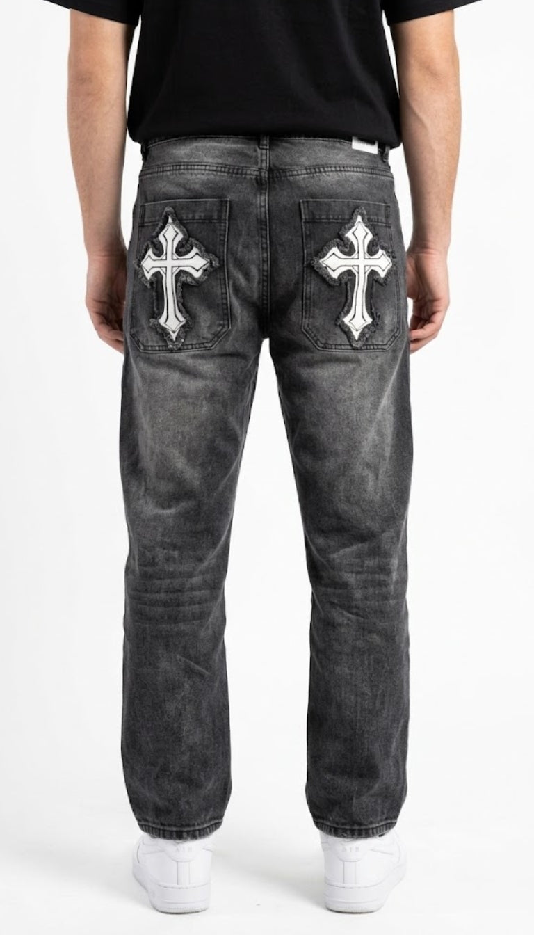 Jeans in denim con toppe a croce