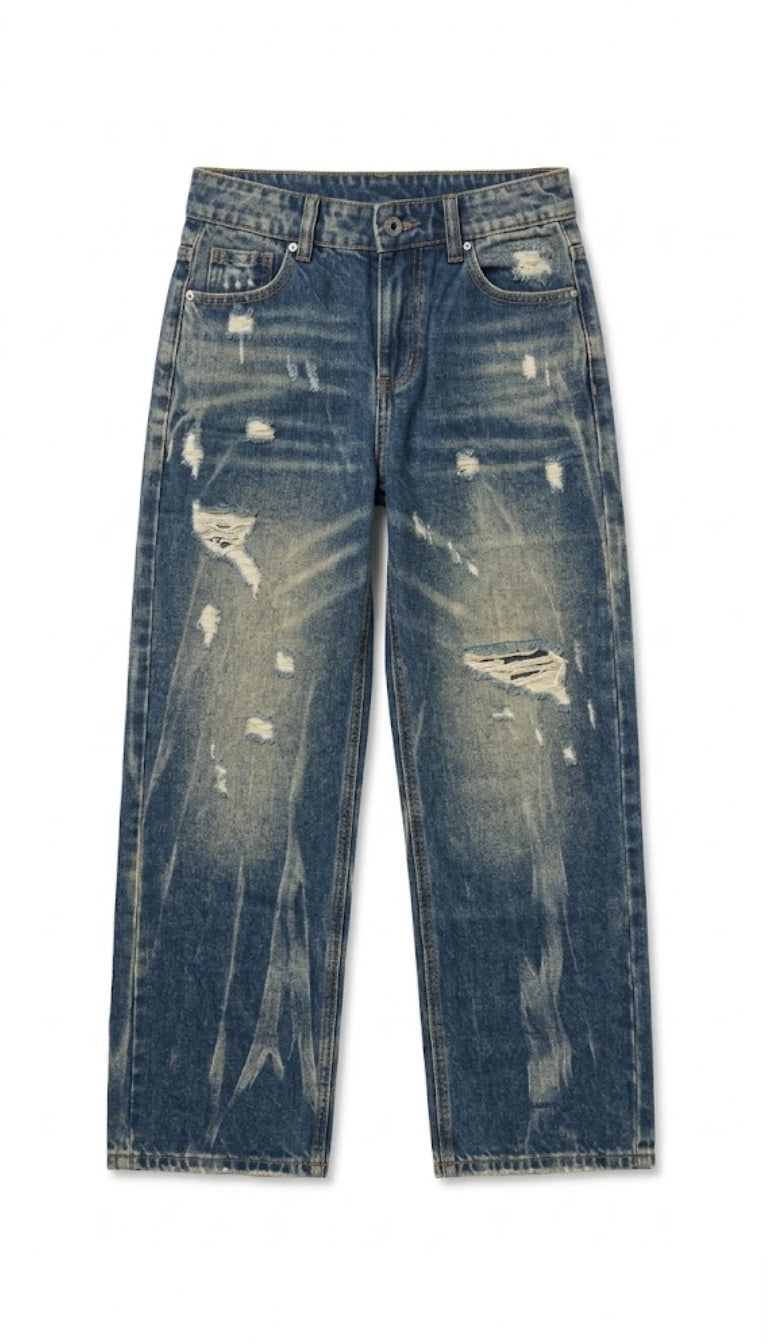 Jeans in denim con strappi e finitura invecchiata
